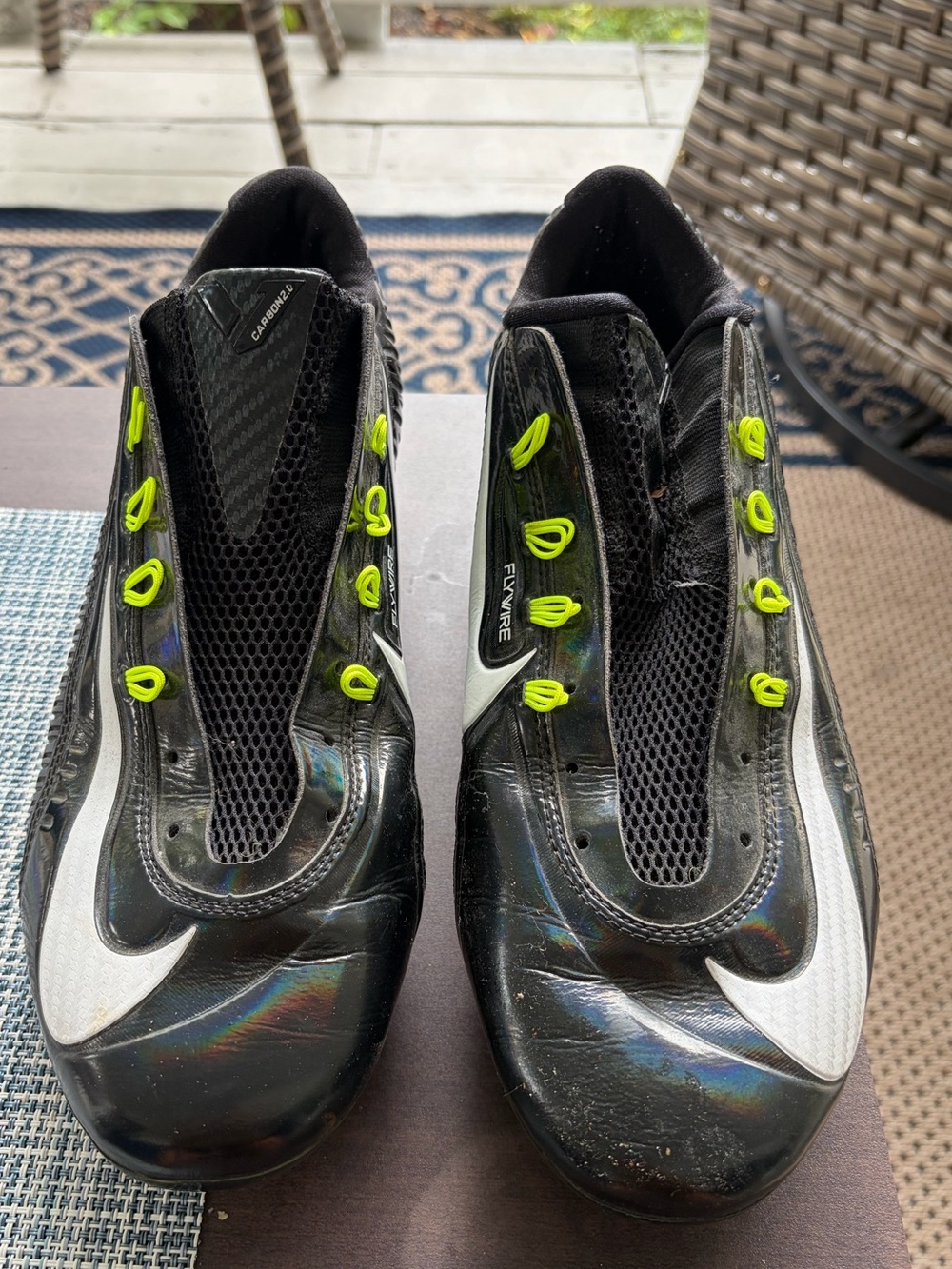 Nike Black Athletic Cleats with Neon Yellow Lace Loops